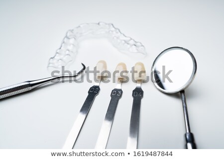 Сток-фото: Dental Mirror Clear Aligner And Shade Matching