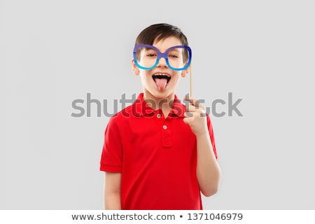 Сток-фото: Happy Boy With Big Paper Glasses Showing Tongue