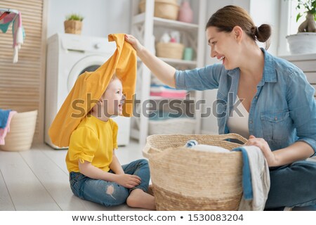 ストックフォト: Smiling Woman Doing Housework