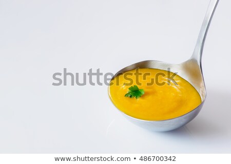 Foto stock: Soup Ladle In The Bowl