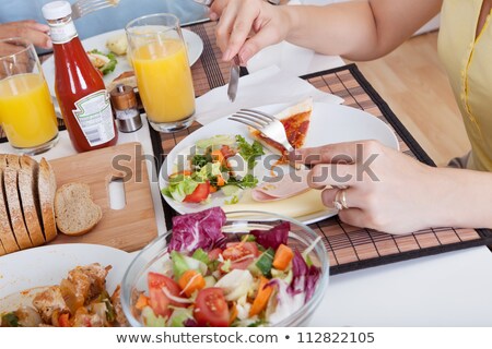 Сток-фото: Close Up Of Family Seated Around Table