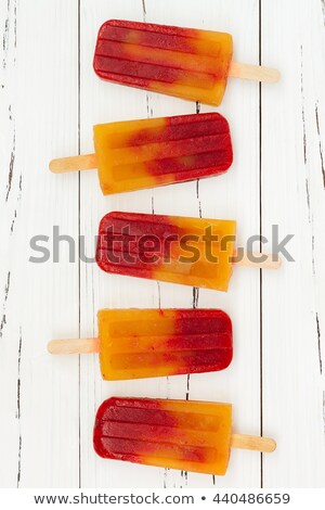 Stockfoto: Refreshing Mango Ice Cream With Slice Peach On A Wooden Stick On A Marble Background Flat Lay