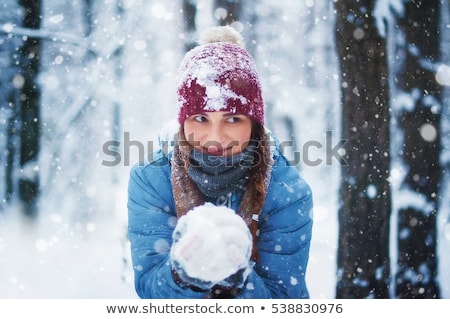 Stock photo: Happy Girl Playing And Throwing Snowball In Winter