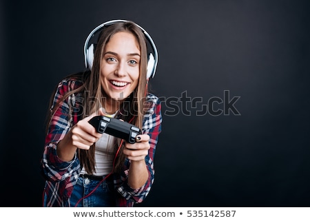 [[stock_photo]]: Young Woman With A Games Console