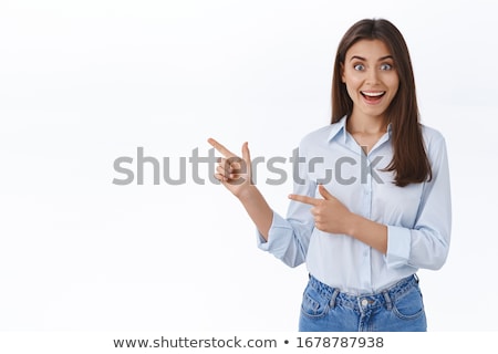 Zdjęcia stock: Stylish Young Woman Looking At You Pointing Left