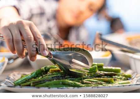 Stock photo: Girl Grabbing Asparagus