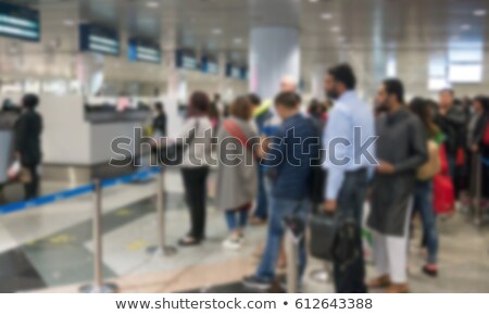 Stockfoto: Air Travelers Queue At Border Passport Control