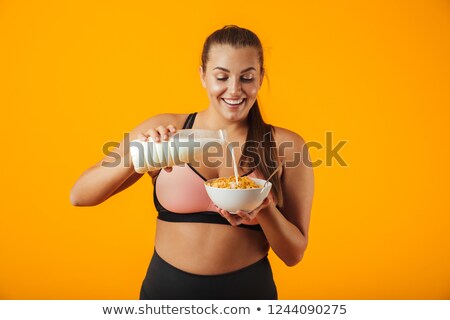 ストックフォト: Image Of Young Overweight Woman In Tracksuit Holding Milk And Co