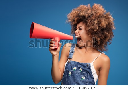 Woman Yelling Into A Loudspeaker Zdjęcia stock © NeonShot