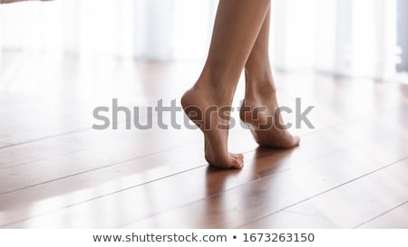 [[stock_photo]]: Woman Standing On Tip Toe