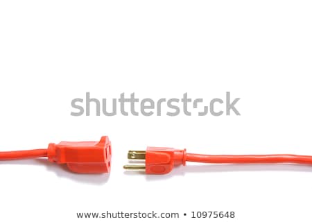 Stok fotoğraf: The Orange Extension Cord On The Ground At The Constructionsite