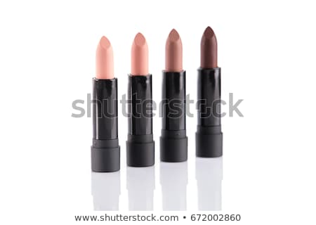 Foto d'archivio: Set Of Red Lipsticks Isolated On White Reflective Background