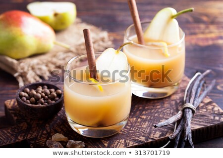 Stok fotoğraf: Pear Mulled Cider With Vanilla And Cinnamon Sticks On A Wooden Background