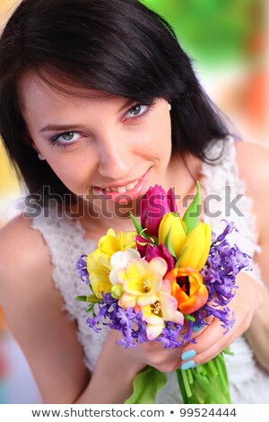 Foto d'archivio: Young Smiling Brunette Woman On Green Background Close Up Exoti