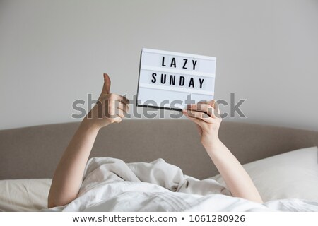 Foto d'archivio: Enjoying Lazy Sunday At Home