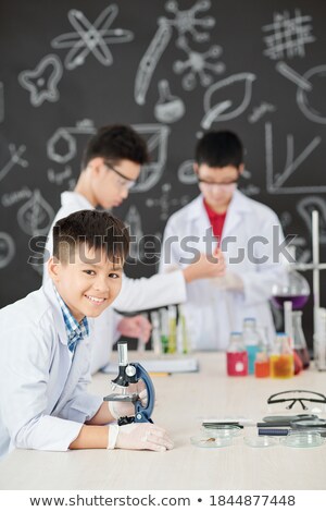 ストックフォト: Schoolboy Working With Microscope