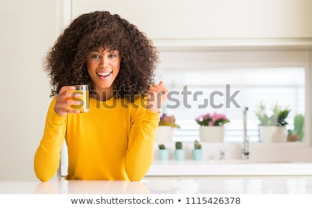 Stock fotó: Woman Drinking Orange Juice