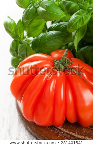 Stock photo: Fresh Tomato With Basil Om Old Wooden Board