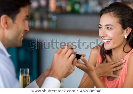 Foto stock: Cheerful Young Man Proposing To A Woman