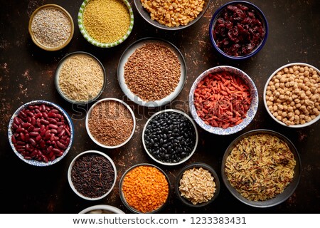 Сток-фото: Various Superfoods In Smal Bowls On Dark Rusty Background