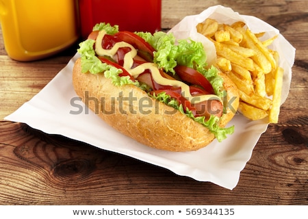 Сток-фото: Hotdog With French Fries On Wooden Plank