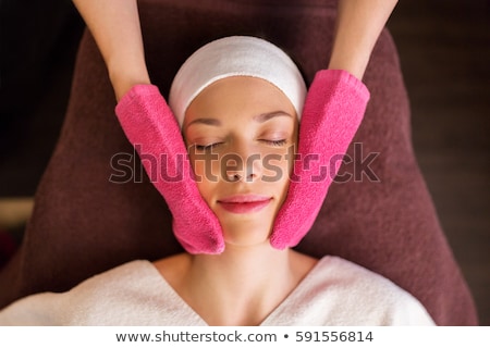 Сток-фото: Woman Having Face Massage With Terry Gloves At Spa