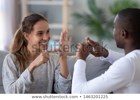 Foto stock: Smiling Deaf Man Learning Sign Language