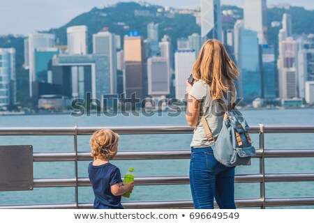 Stock photo: Young Woman And Her Son Taking Photos Of Victoria Harbor In Hong Kong China
