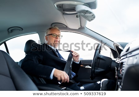 Foto stock: Senior Businessman Fastening Car Seat Belt