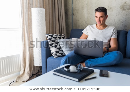 ストックフォト: Young Man With Laptop At Home