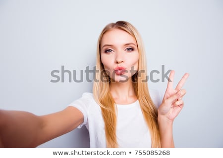 Сток-фото: Young Casual Woman Making The Victory Sign