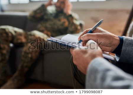 [[stock_photo]]: Hand With Pen Writing Psychiatry