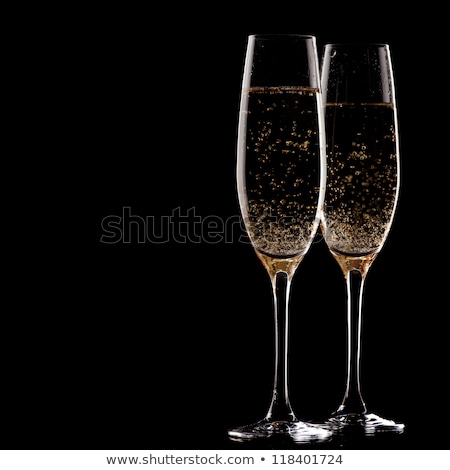 Foto d'archivio: Two Champagne Glasses Over Christmas Background