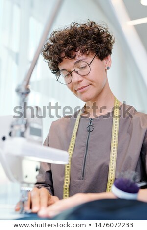 Stockfoto: The Woman Tailor Working On New Clothing