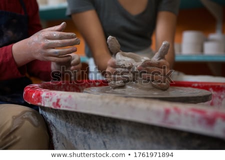 Сток-фото: Mid Section Of Female Potter Molding A Clay