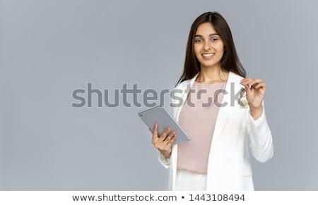 ストックフォト: Young Businesswoman With Digital Tablet By The Wall In Modern Of