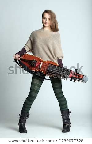 Zdjęcia stock: Attractive Modern Female Musician With Nyckelharpa