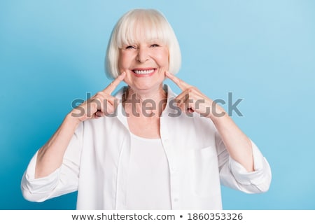 Stok fotoğraf: Senior Woman Pointing On Tooth