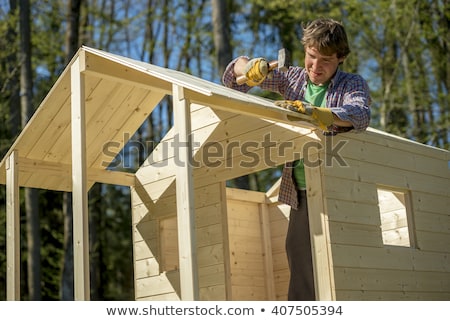 Stok fotoğraf: Mallet With Nails And Planks Of New Wood