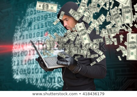 Zdjęcia stock: Composite Image Of Hacker Holding Laptop And Credir Card