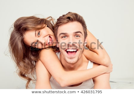 Stock fotó: Portrait Of A Beautiful Young Happy Smiling Couple