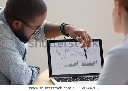 ストックフォト: Finance Trade Manager Showing Reports Screen Analysis Finance Cu