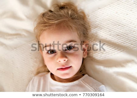 Stockfoto: Young Daughter Two Years Old Relaxing In Bed Positive Feelings