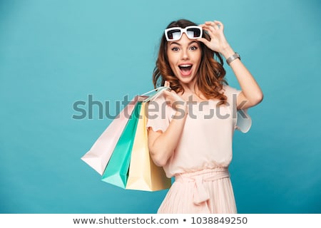 Stockfoto: Excited Young Woman Wearing Sunglasses