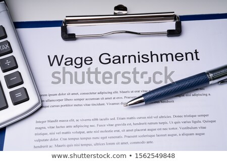 Сток-фото: High Angle View Of Wage Garnishment Documents With Calculator An