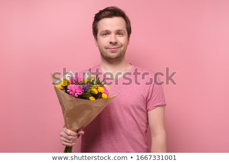 Stok fotoğraf: Smiling Young Man Standing On His Hands