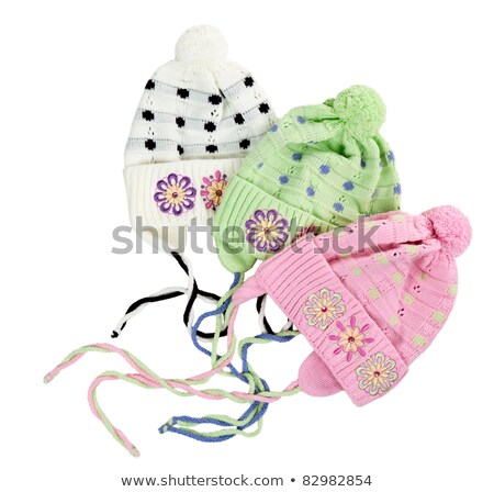 Stock foto: Three Colored Childrens Knitted Hat With A Flower Pattern
