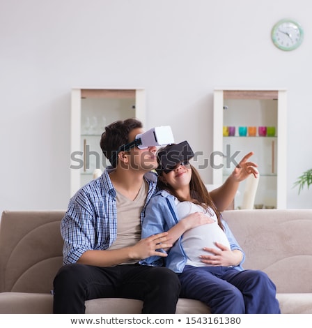 Pregnant Woman Watching 3d On Pad [[stock_photo]] © Elnur