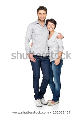 Сток-фото: Young Casual Couple Standing Embraced
