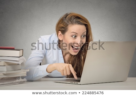 Foto stock: Funny Woman Working On Computer Ready To Press Enter Button